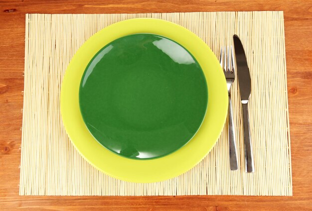 Table setting on wooden background closeup