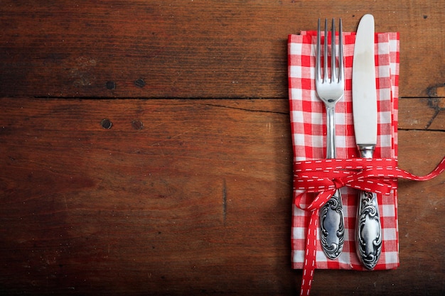 Table setting on wooden background