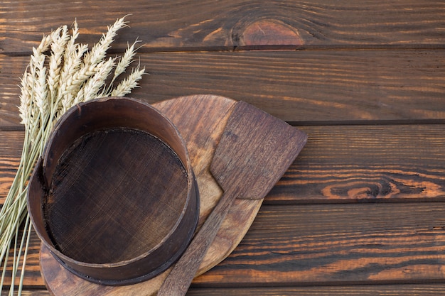 on the table a shovel, a sieve for flour