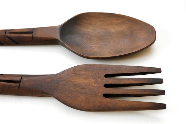 Table spoon and fork from wood isolated on white