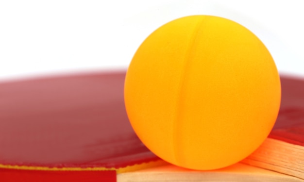 Table tennis ball with bat over white background