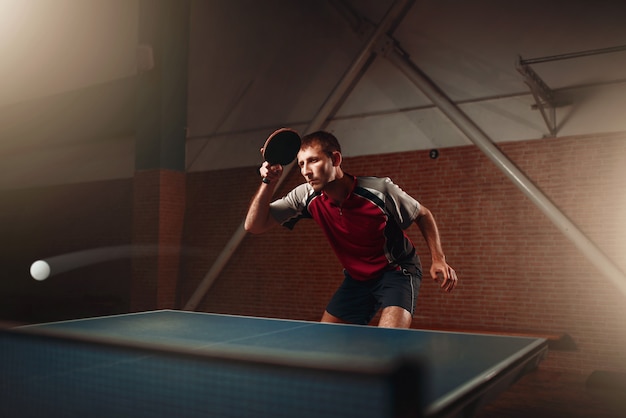 Table tennis, player in action, ball with trace