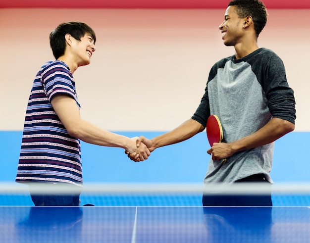 Table tennis players shaking hands