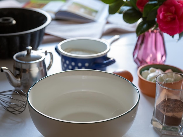 A table with a bowl and a cup of coffee on it