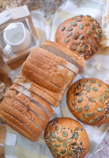 A table with breads and a coffee maker on it