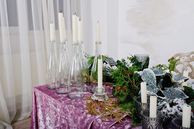 Table with candles and decor. Happy winter holidays concept.