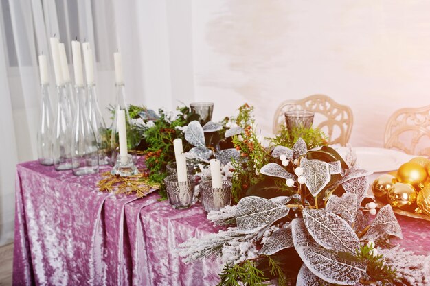 Table with candles and decor Happy winter holidays concept