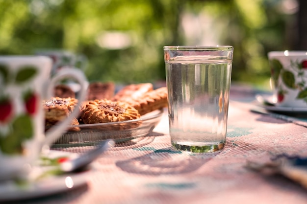 Table with cup empty glass and food for breakfast in the morning