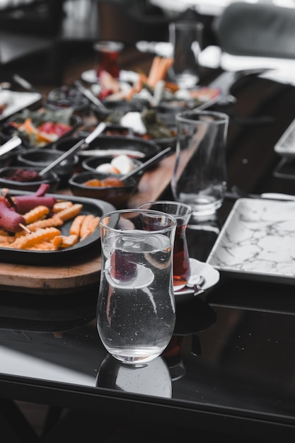 a table with food and a glass of water on it