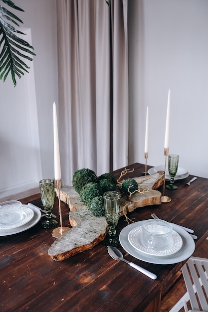 A table with green plants on it in the form of a serving