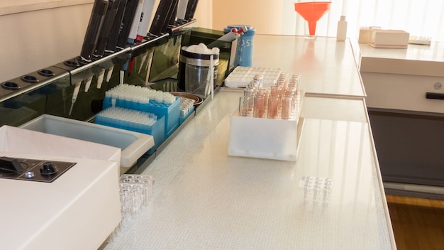 Table with medical laboratory instruments for analysis of blood samples