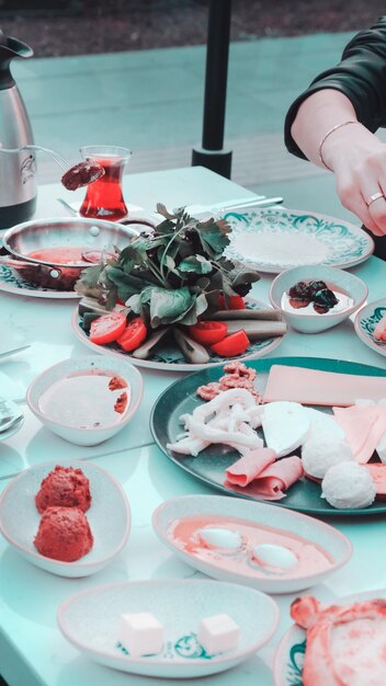 a table with plates of food including strawberries strawberries and other foods