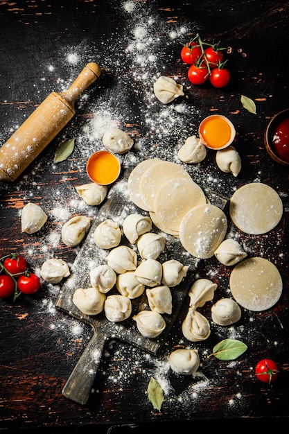 A table with a rolling pin and a rolling pin with the word ravioli on it