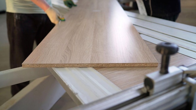 A table with a shelf that has a white sheet on it.