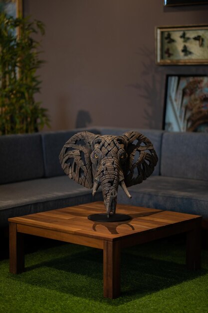 A table with a statue of an elephant on it