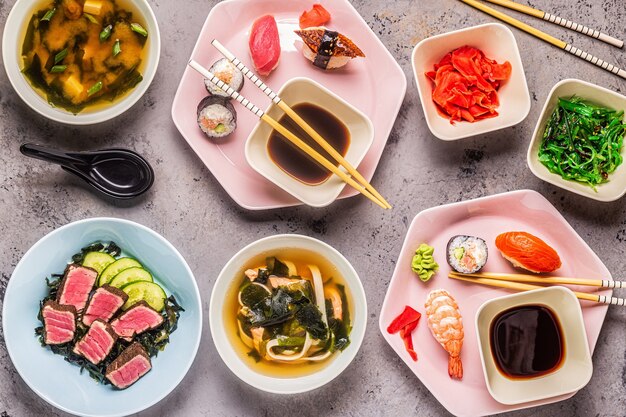 Table with traditional japanese food, top view.