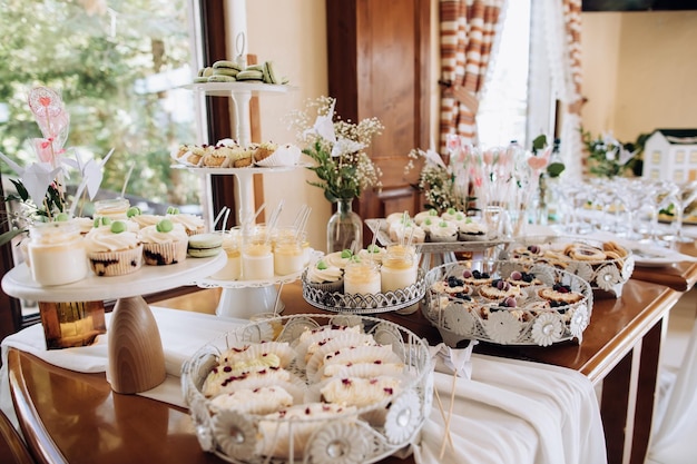 Table with a variety of sweets Cookies chocolate cakes eclairs