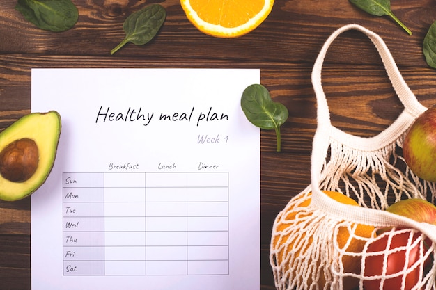 A table with a weekly nutrition plan. The concept of healthy eating and losing weight.