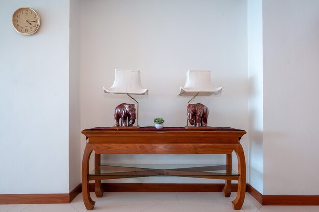 Photo table with wood elephant lamp