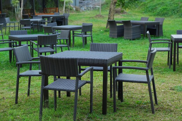 Tableable and chairs for outdoor with nature as background Kursi dan meja taman