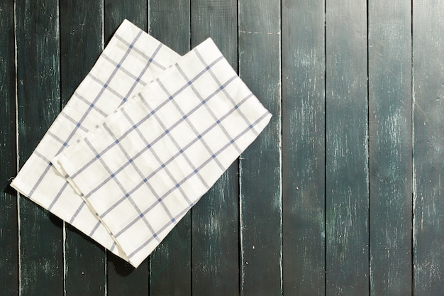 Photo tablecloth on black wooden table