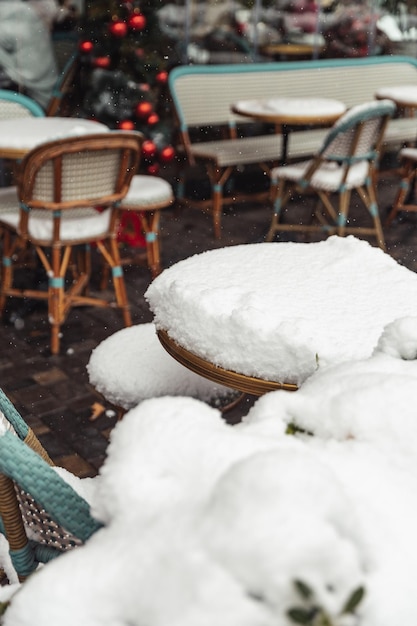 Tables in cafes covered with snow