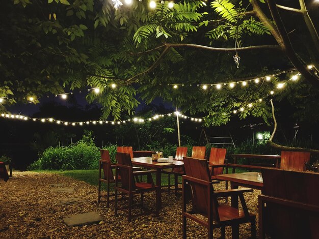 Photo tables and chairs at illuminated yard