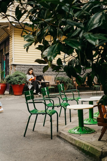 Photo tables and chairs on street side stock photo