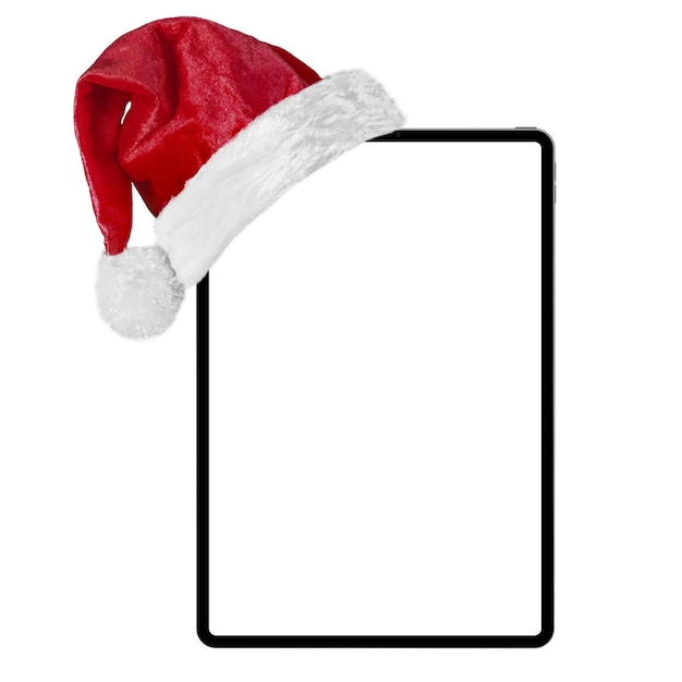 Foto computer tablet isolato con un cappello di babbo natale per natale sullo sfondo bianco