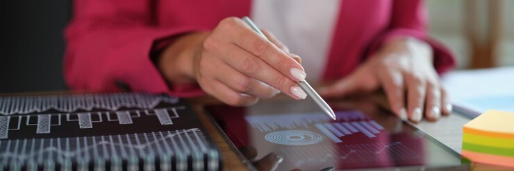 Photo tablet in female hands with financial figures and sales growth profit applications for