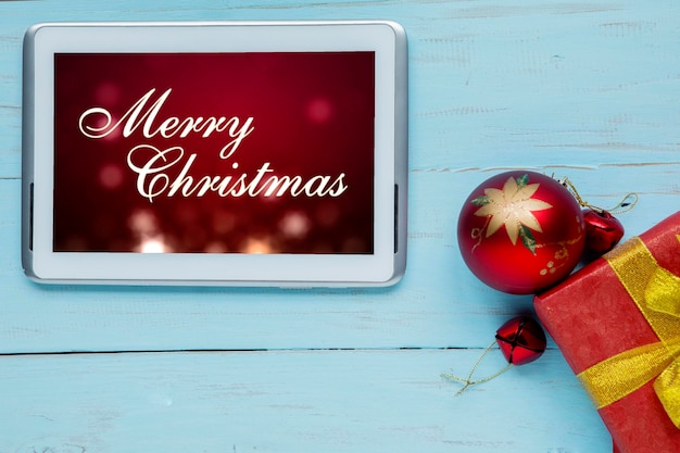 Tablet met tekst voor de groet Merry Christmas