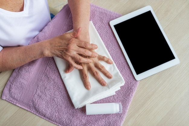 Tablet mockup hand selfmassage for the elderly instruction mobile app