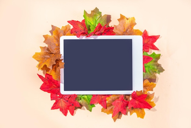 Tablet with autumn leaves