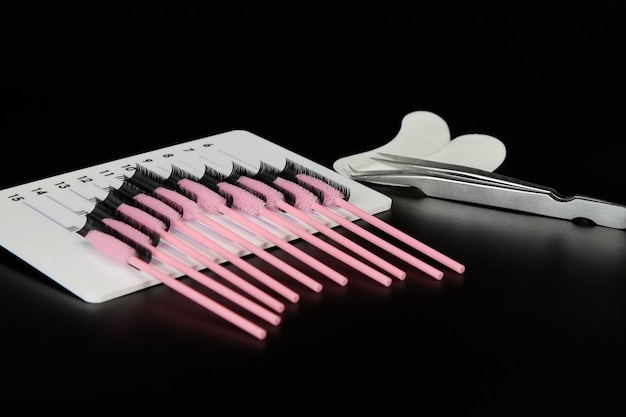 A tablet with false eyelashes eyelash brushes and patches