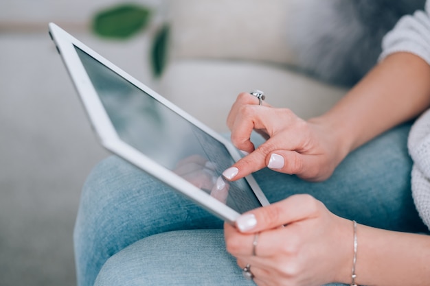 tablet in woman hands. blog social media online business. empty screen mockup