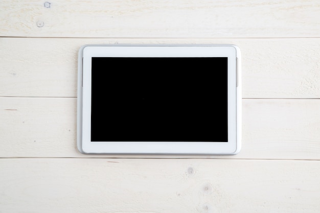 Tablet on wooden  table