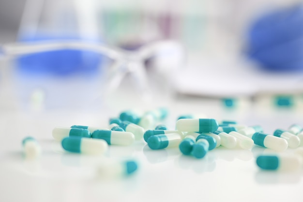 Tablets scattered on the table of the pharmaceutical