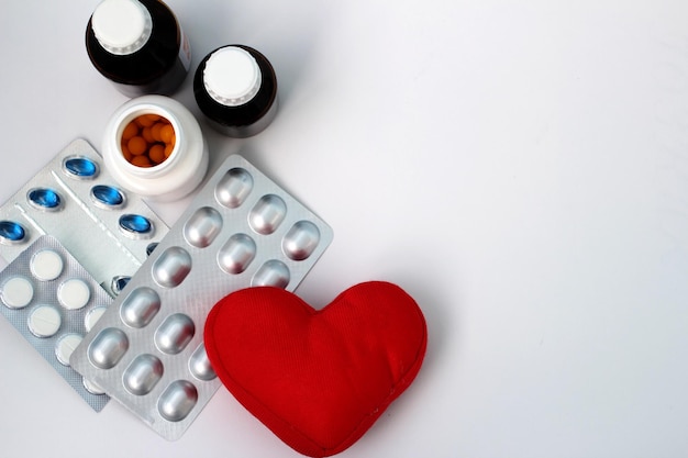 Tablets and a symbol of health in the form of a heart