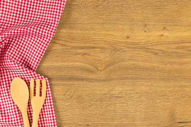 Tableware on wooden background. Top view with space for your text.