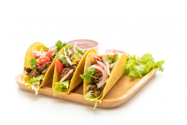 tacos with meat and vegetables isolated on white 