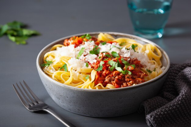 Tagliatelle bolognese with herbs and parmesan, italian pasta