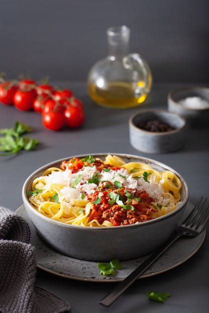 Tagliatelle bolognese with herbs and parmesan, italian pasta