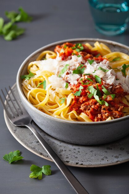 Tagliatelle bolognese with herbs and parmesan, italian pasta