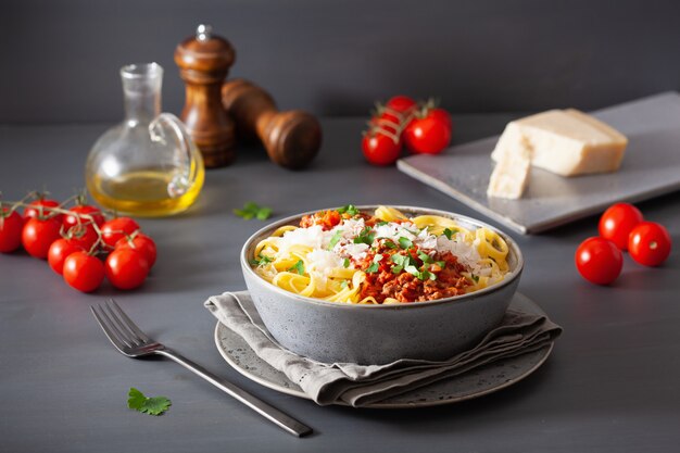 Tagliatelle bolognese with herbs and parmesan, italian pasta