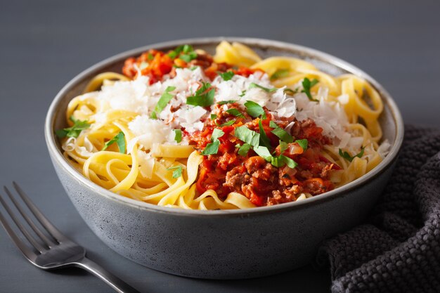 Tagliatelle bolognese with herbs and parmesan, italian pasta