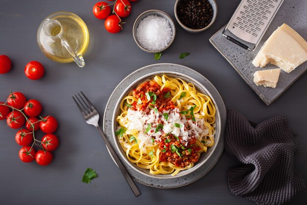 Tagliatelle bolognese with herbs and parmesan, italian pasta