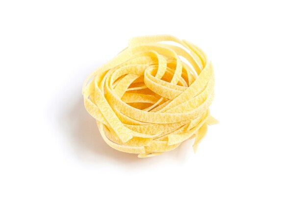 Tagliatelle italian pasta isolated on white background