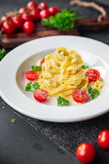 tagliatelle pasta tomato and parmesan cheese healthy meal food snack on the table copy space food