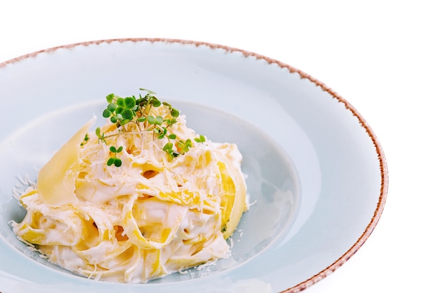 Tagliatelle pasta with cream sauce and parmesan cheese