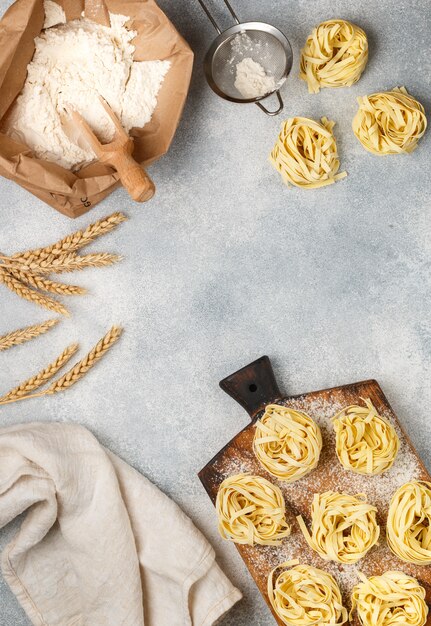 Tagliatelle uncooked on a table